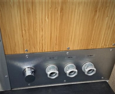 Quick Release Water Fittings and Mixing Faucet shown on Wheel Well Cabinet