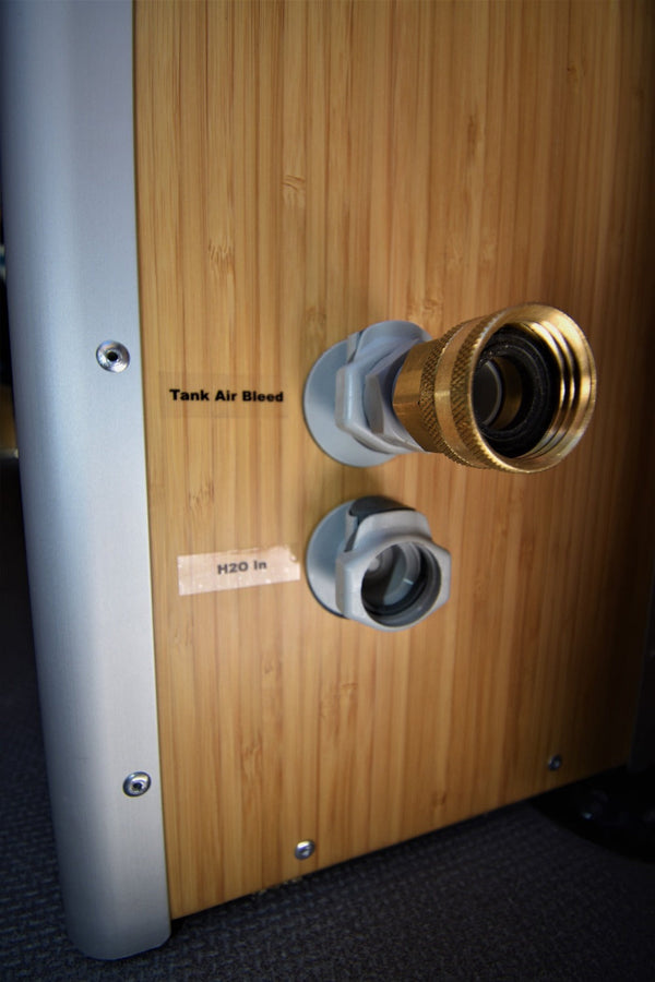 Quick Release Water Fittings shown on Wheel Well Cabinet for Campervan